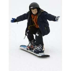  9 Year Old Boy Riding His Snowboard, New York, USA 