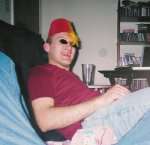 This picture, of me wearing a Fez hat and broken sunglasses, was taken 