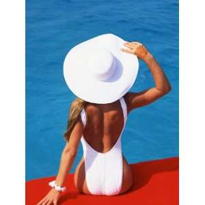  Young Woman in Swimsuit with Wide Brimmed Hat Stretched 