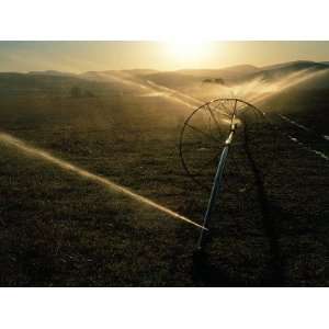  Water Sprinklers Irrigate the Land at Sunset Photographic 