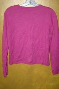 You are considering a pretty little dark pink (fuschia) sweater