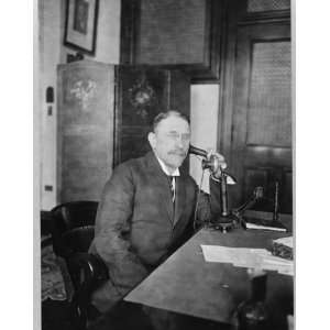  1913 photo Henry Morgenthau seated at desk holding 