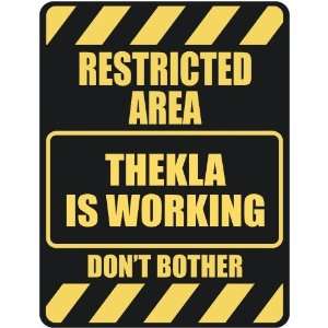   RESTRICTED AREA THEKLA IS WORKING  PARKING SIGN