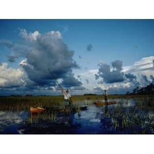 Men Pole Canoes of Seminole Design across the Swamps Photographic 