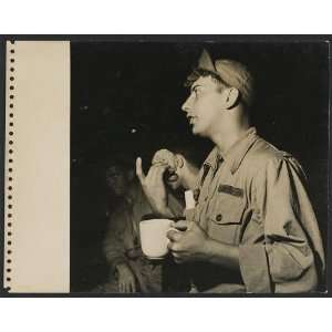   base in Guam holding a cup,a doughnut,July 1945,WWII