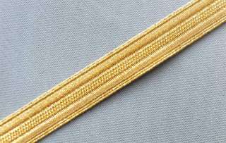 Bright gold, jacquard ribbon trim. Metallic gold on gold design.