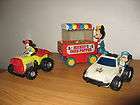 Mikey Corn Popper, Cop Car, and Tractor