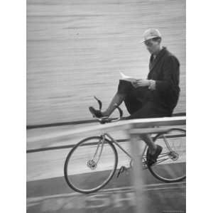 Bicyclist William Anderson Reading a Letter While Biking During a Six 