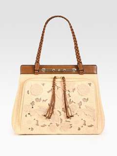 Floral detailing adds a touch of romance to this straw carryall 