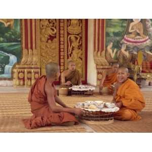  Group of Buddhist Monks in Saffron Robes Sitting on the 