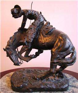   remington bronze statue with marble base approximately 11 25 high